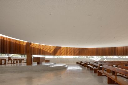 Interior of church with wooden pews and slats