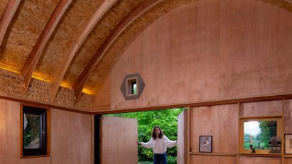 Boano Prišmontas tops art barn with curved CNC-cut roof