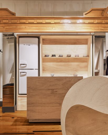 Plywood shelving with a small fridge installed inside