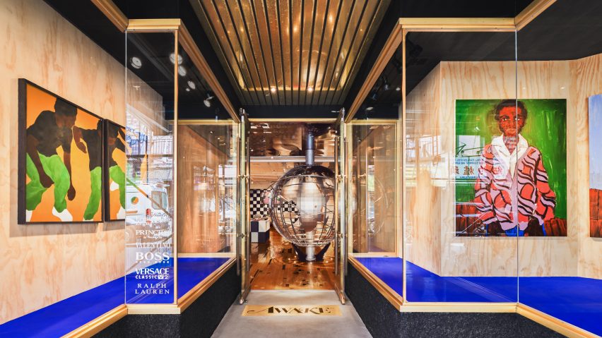 Store entrance with blue-carpeted vitrines either side