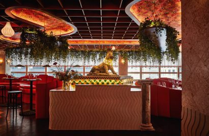 Boar sculpture on a patterned podium
