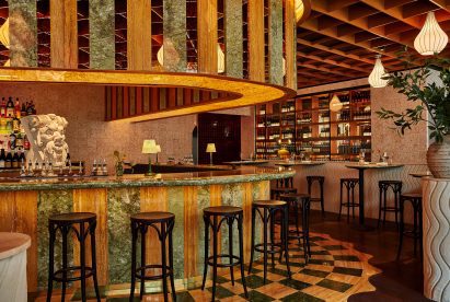 Bar clad in marble and glass stripes