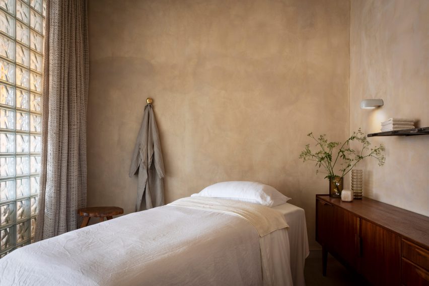 bed in a treatment room made from glass bricks