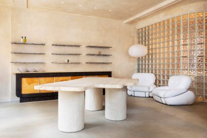 table and two armchairs in modern retails space big beauty