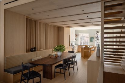 Large dining area with built-in bench and walnut table