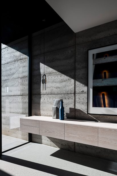 Rammed-earth wall in a bedroom