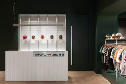 White service counter in front of a dark green wall