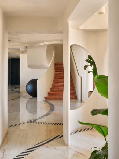 Hallway and staircase in Clermont Residence by FADD Studio
