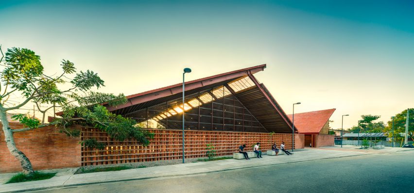 Exterior of the Casa de Musica brick and timber school with a pitched roof