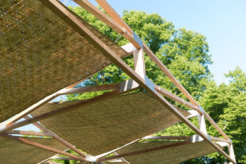Underside of a timber structure roof with woven bamboo inserts
