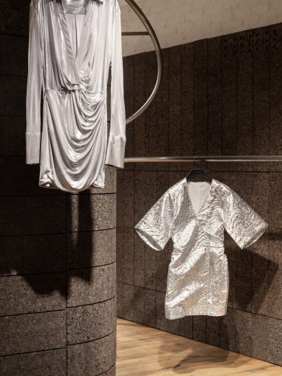 Garments hanging from metal rails