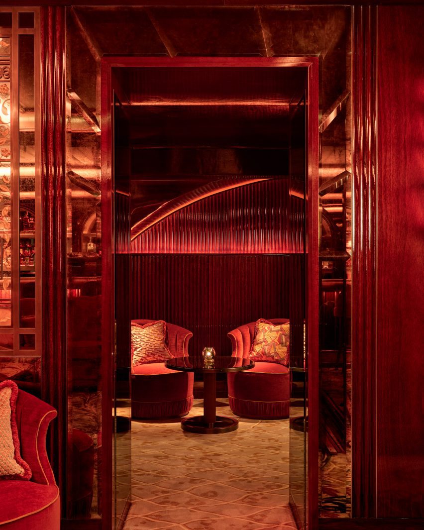 mirrored door frames lead to private seating areas and niches