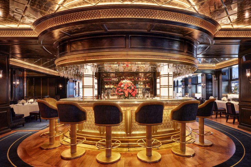circular bar with metal latticework and high bar stools