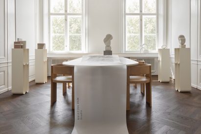Photo of a room with tables and chairs