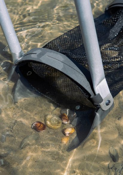 Photo of a tool, similar to a spade and a landing net