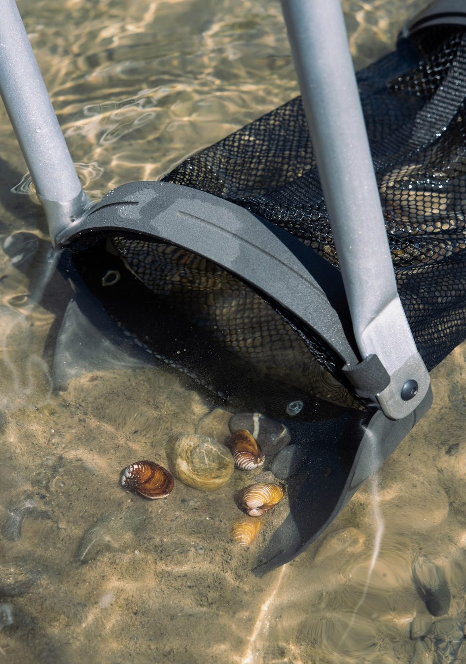 Photo of a tool, similar to a spade and a landing net