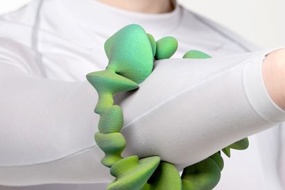Green ombre bulbous bracelet on a person's arm by a Lucerne School of Art and Design student