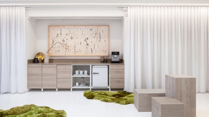 Coffee station revealed behind white curtains