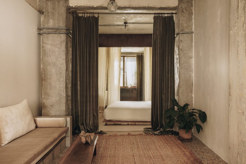 Mona Athens guest room with exposed concrete walls