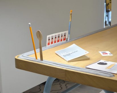 Desk with slot for storage around edge