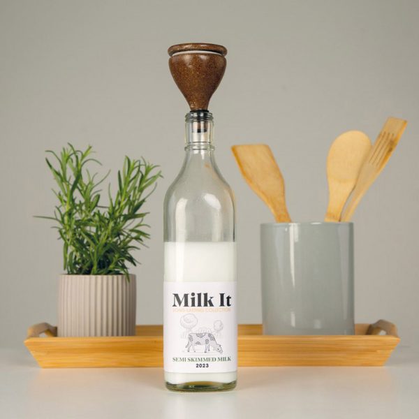 Glass milk bottle with wooden spout that safely sours milk