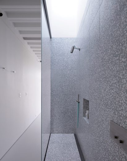 Grey bathroom at Narrow House by Only If