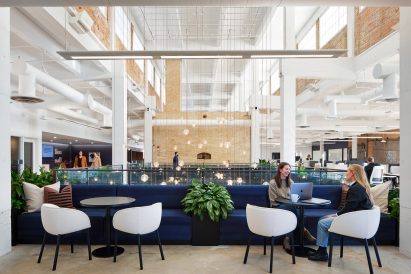 Dark blue lounge seating in front of atrium