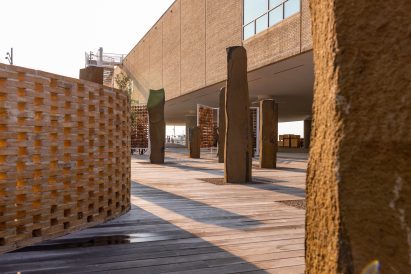 Stone sculptures and perforated brick wall