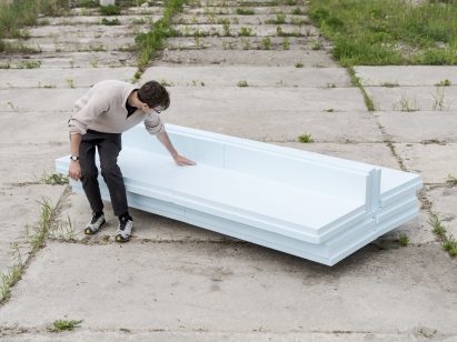 Person sitting on a foam couch