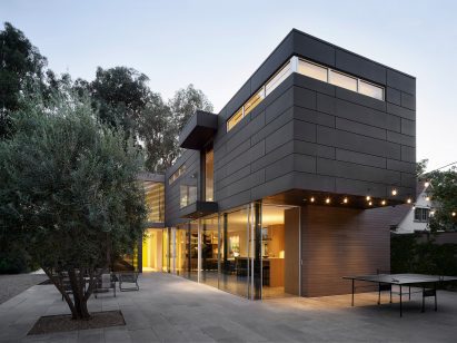 Boxy residential volume with sliding glass doors