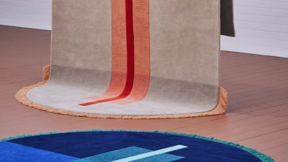 Two round-edged rugs in showroom