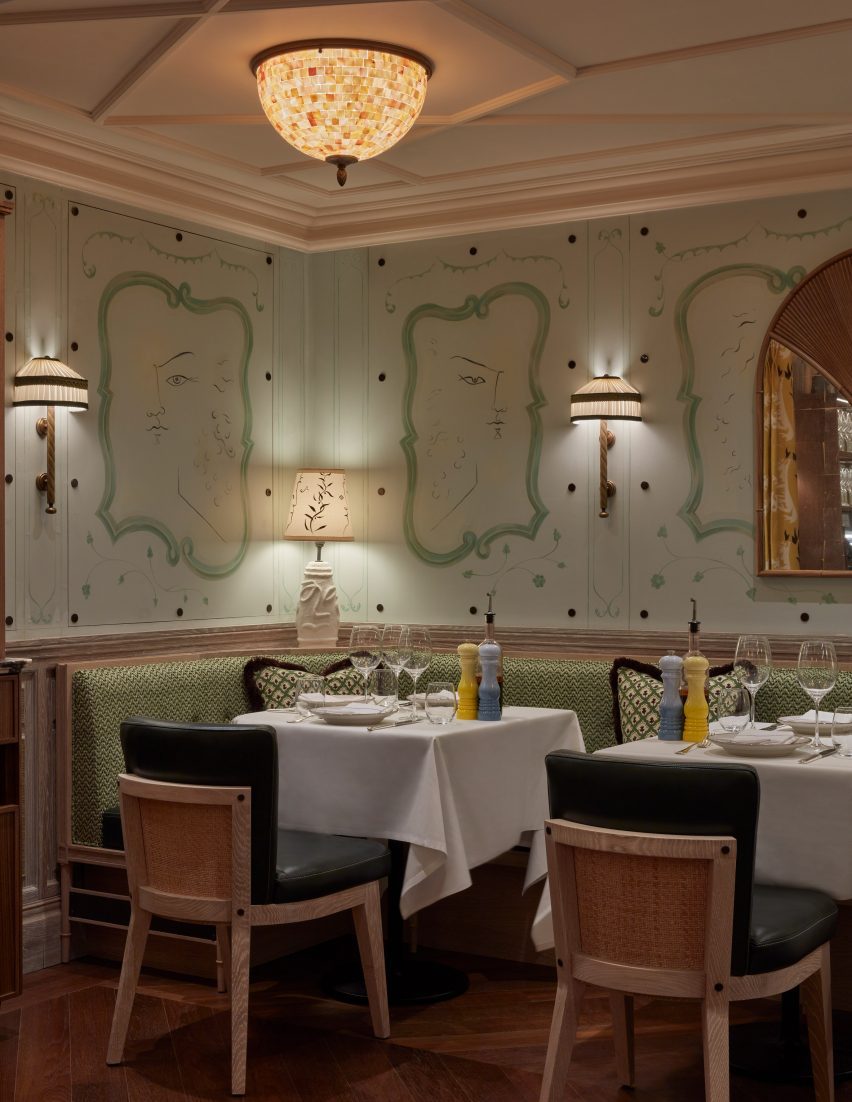 Restaurant interior with ceiling moulding and green decorative walls