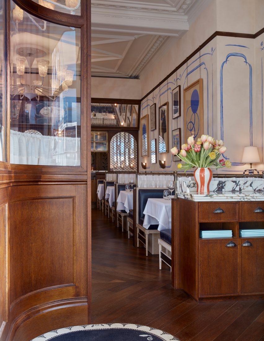 Entrance to the Socca restaurant with wood wall panelling