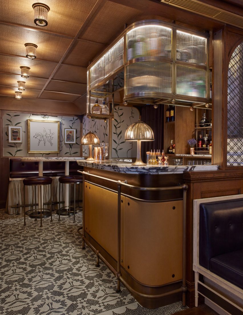 Bar interior with wood-panelled walls and mosaic flooring