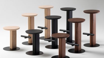 Wooden stools lined up in height order