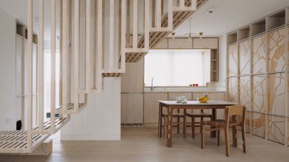 Staircase and kitchen in Dragon Flat by Tsuruta Architects