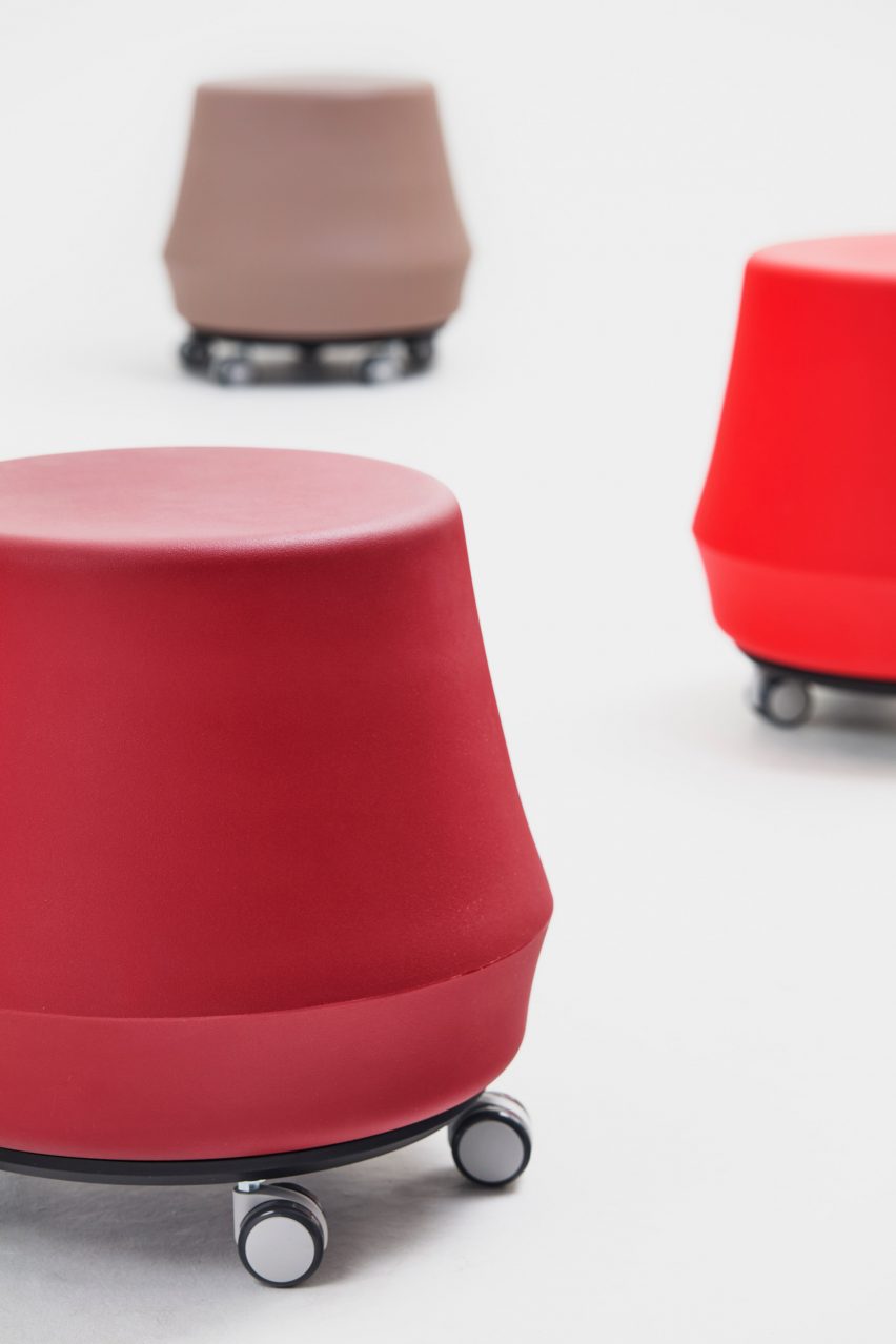 Three red and brown Stump stools by Derlot with wheels