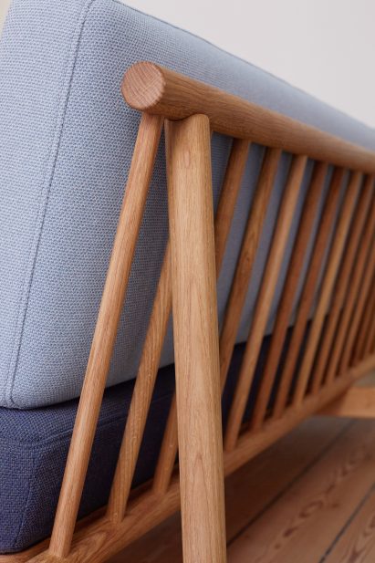 Detail of back of sofa with wooden spokes visible