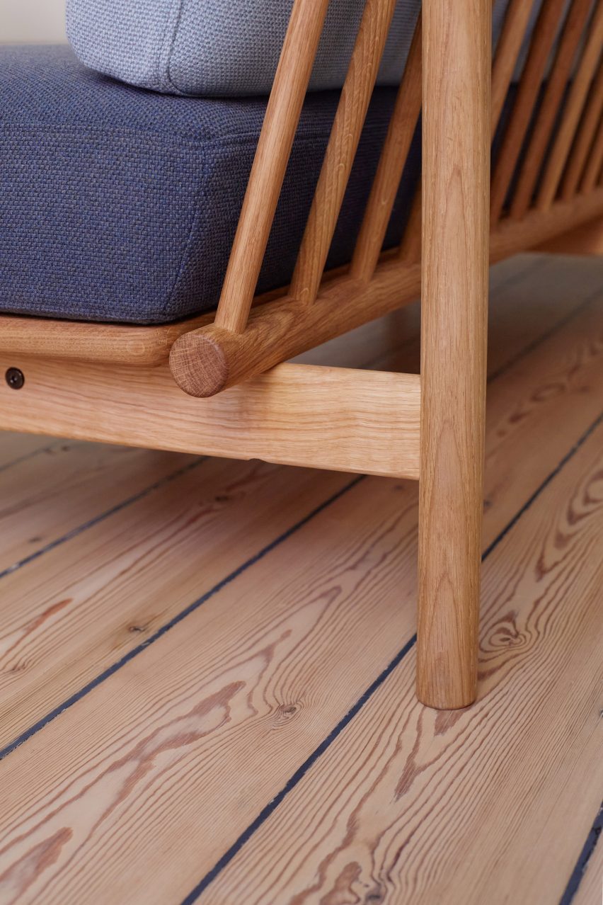 Detail of back of sofa with wooden spokes visible