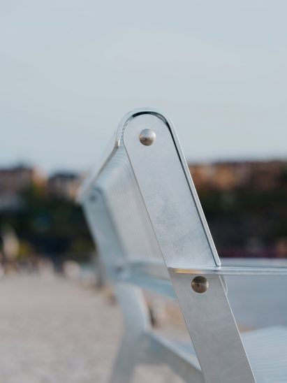 Close-up photo of the Tellus bench backrest showing screw detail