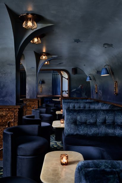 Mural of aquatic creatures across walls and vaulted ceiling