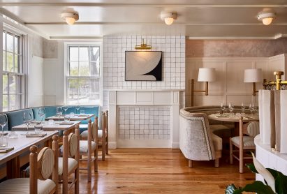 Bright dining room with tiled-covered chimney stack