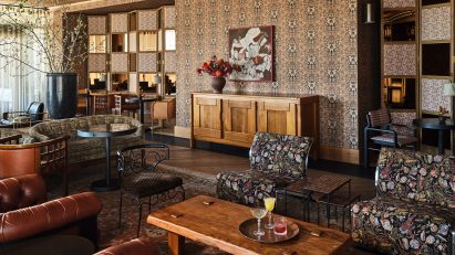 Golden patterned wallpaper covers the walls