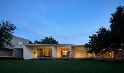 One-storey home with floor-to-ceiling windows separated by white walls