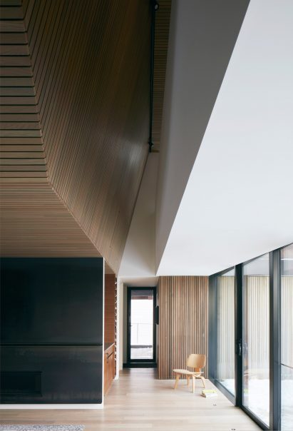 Open concept living room with cedar panelling