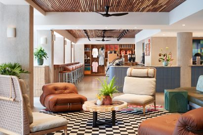Hotel lobby with a variety of seats on a checkered rug
