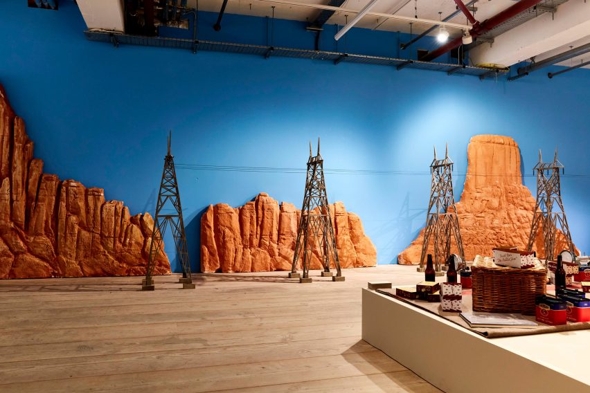 Miniature film set telephone poles with a desert backdrop