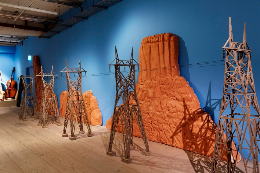 Miniature film set telephone poles with a desert backdrop
