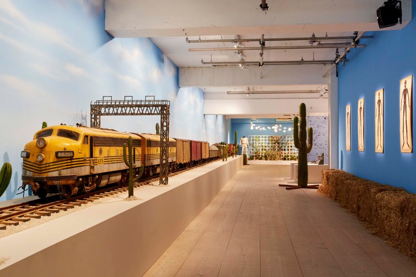 Asteroid City exhibition with a model train and cactus