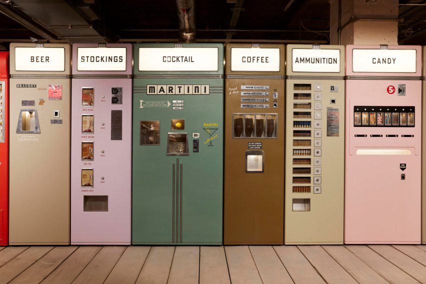 A series of colourful vending machines on wooden decking
